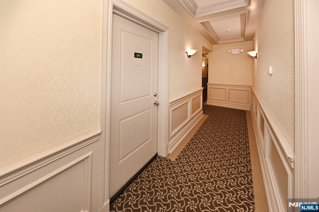 2303 Rio Vista Lane Northvale, NJ 07647 - Photo 6 of 30 a view of a hallway with wooden floor and staircase