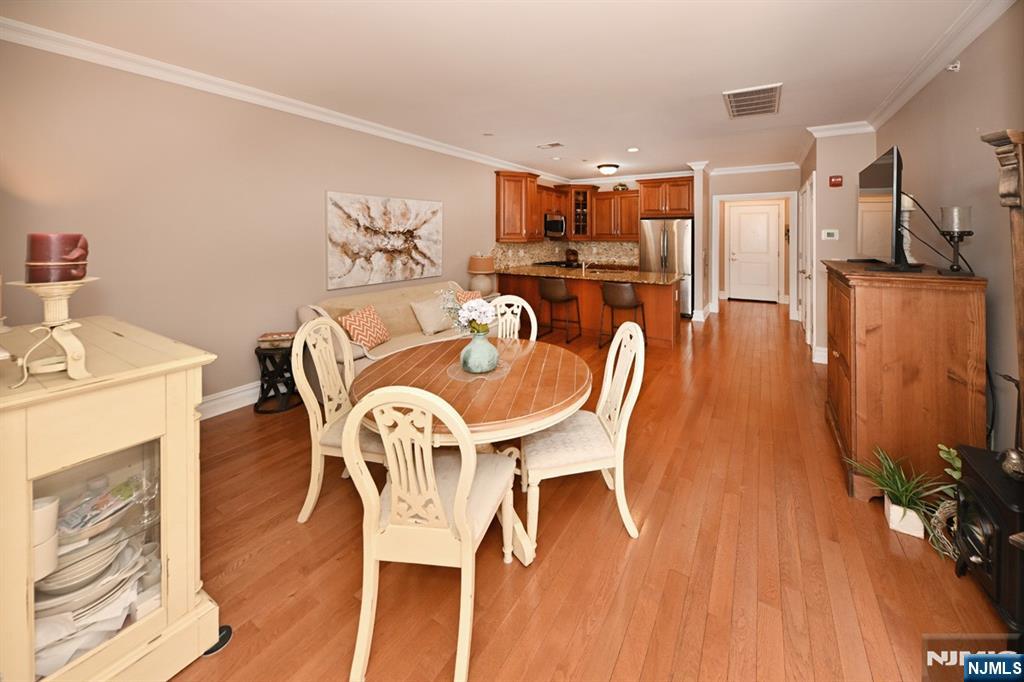 2303 Rio Vista Lane Northvale, NJ 07647 - Photo 9 of 30 a dining room with furniture and wooden floor