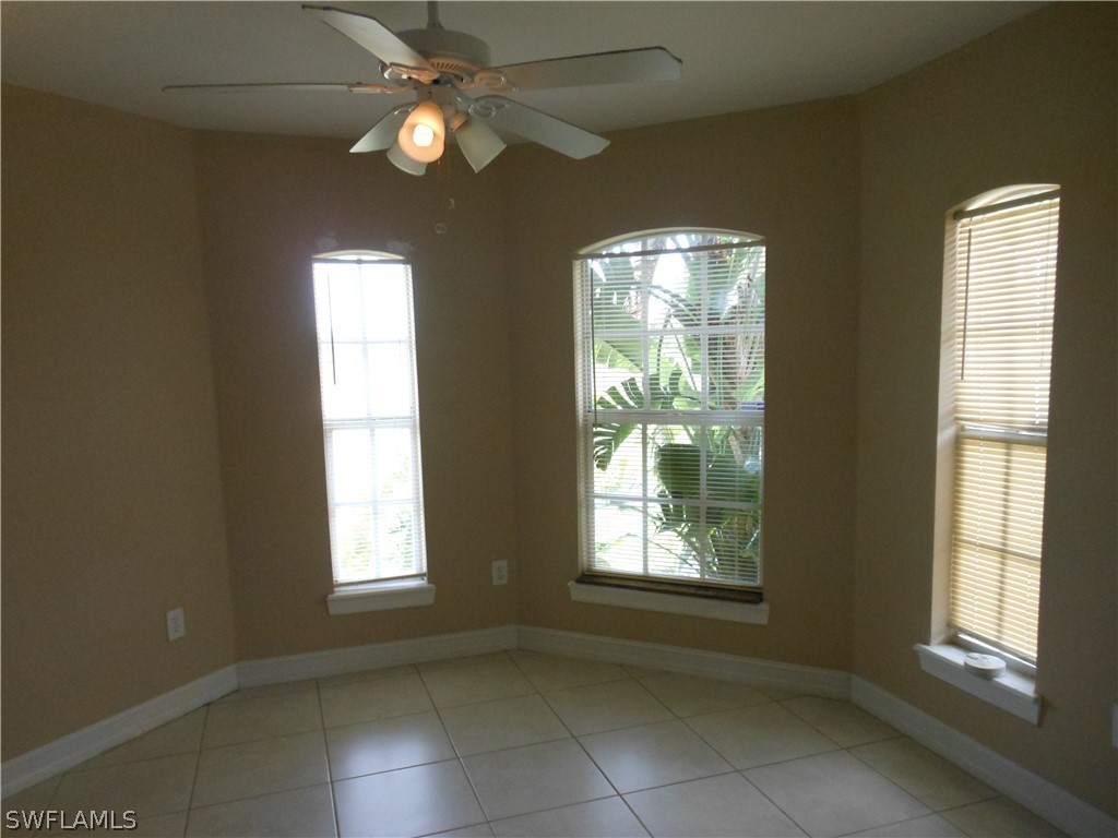 765 Homestead Road South Lehigh Acres, FL 33974 - Photo 4 of 20 a view of an empty room with a window