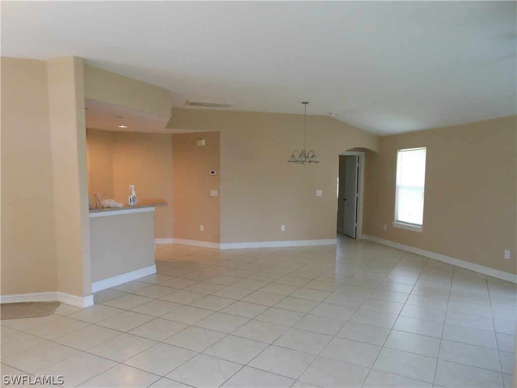 765 Homestead Road South Lehigh Acres, FL 33974 - Photo 8 of 20 an empty room with a empty space and windows