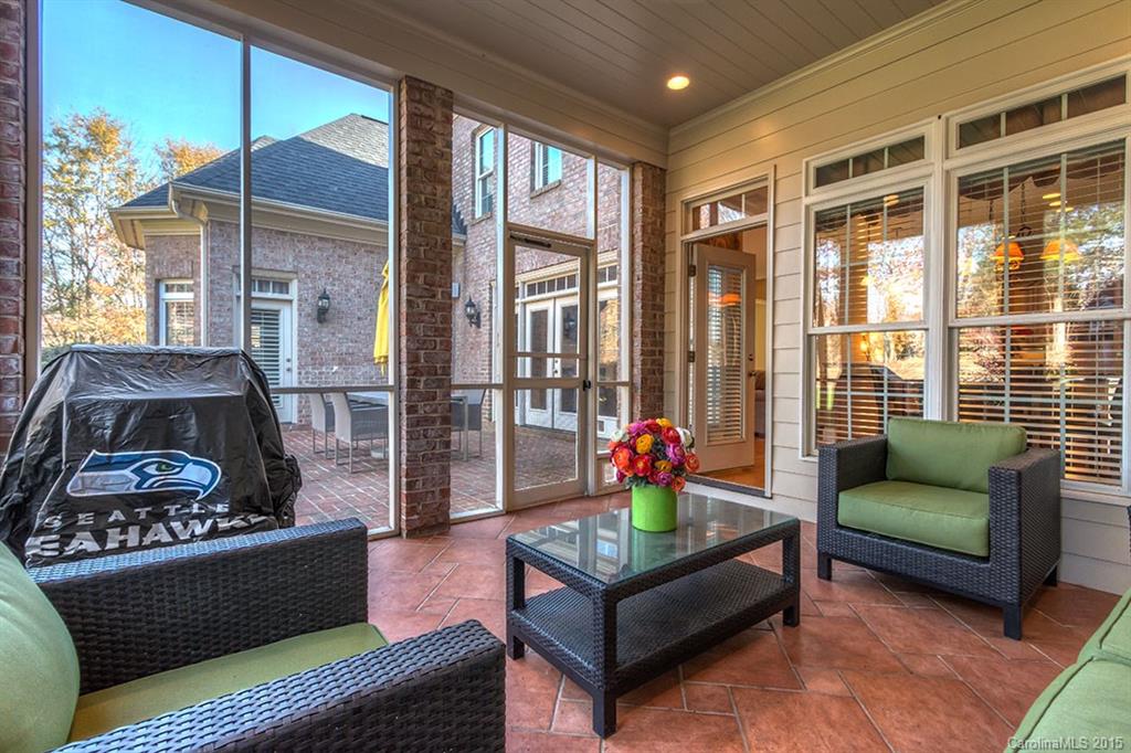 5704 Riley's Ridge Road Charlotte, NC 28226 - Photo 22 of 24 a living room with furniture and a floor to ceiling window
