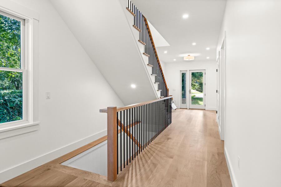 34 Davis Street Vineyard Haven, MA 02568 - Photo 13 of 26 a view of a hallway with wooden floor and stairs