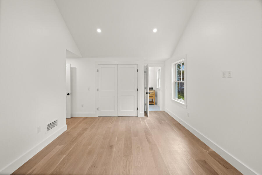 34 Davis Street Vineyard Haven, MA 02568 - Photo 22 of 26 a view of an empty room with wooden floor