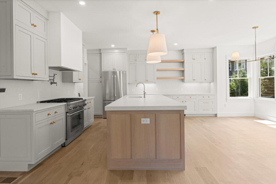 34 Davis Street Vineyard Haven, MA 02568 - Photo 8 of 26 a kitchen with stainless steel appliances granite countertop a sink a stove and a refrigerator