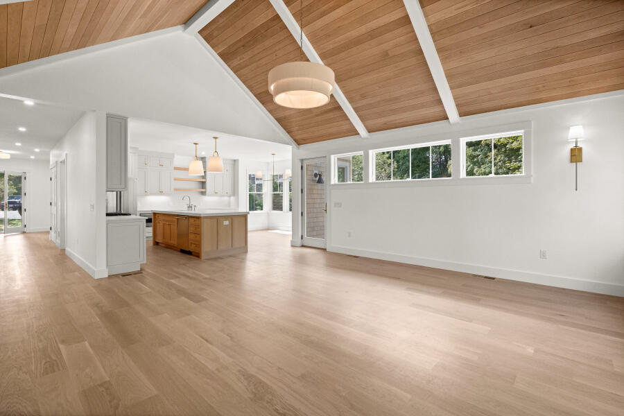 34 Davis Street Vineyard Haven, MA 02568 - Photo 10 of 26 a view of a big room with wooden floor and a window