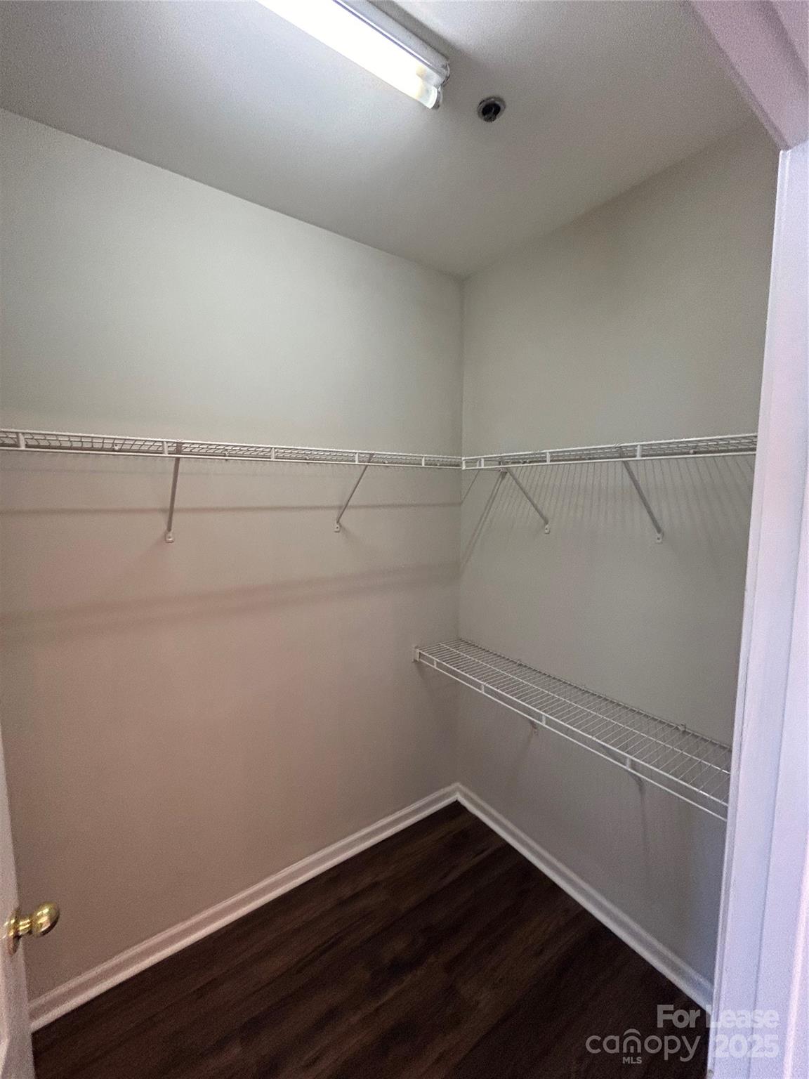 18605 Ruffner Drive, Unit 1D Cornelius, NC 28031 - Photo 12 of 14 a view of a room with racks on the wall