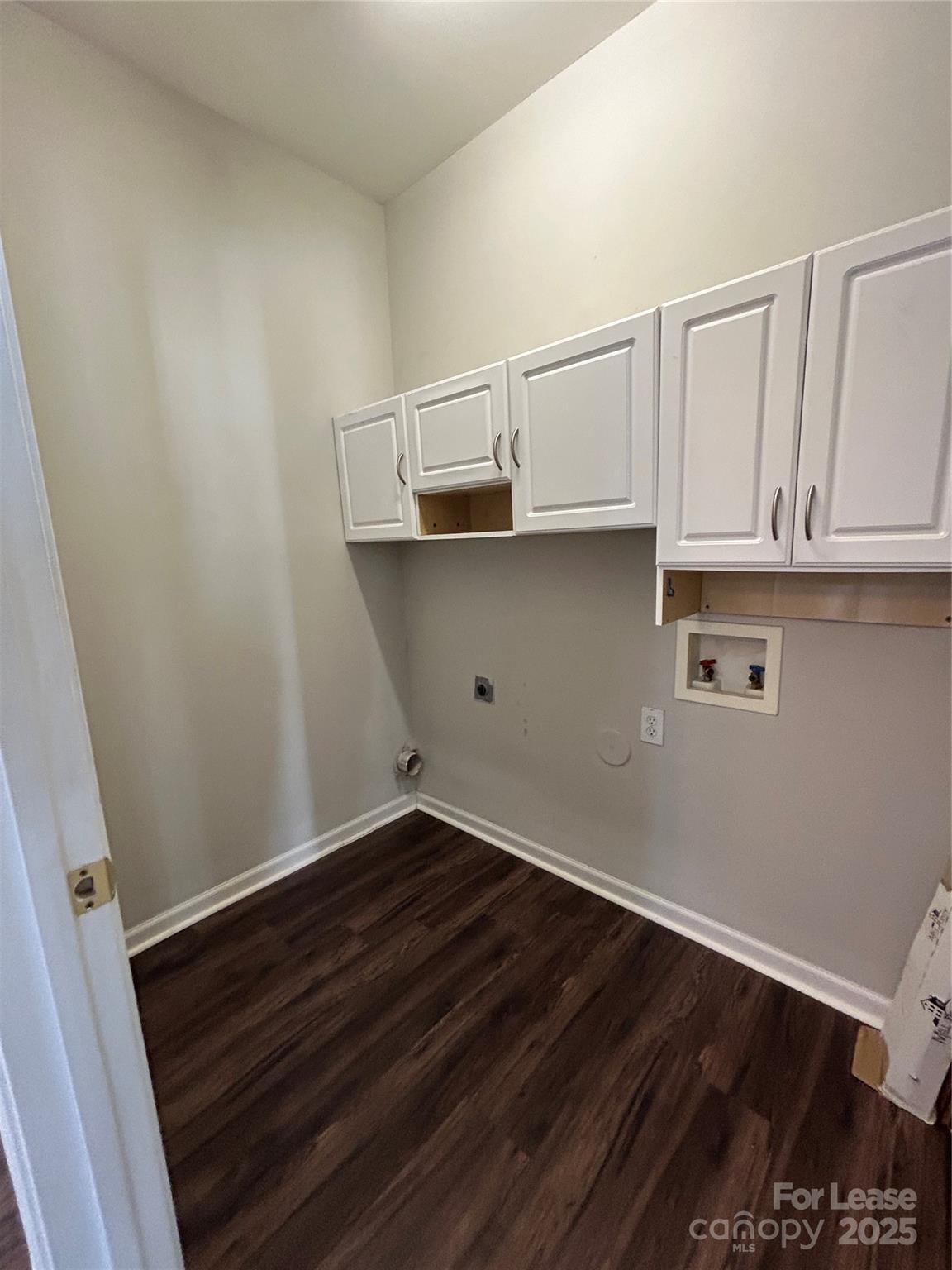 18605 Ruffner Drive, Unit 1D Cornelius, NC 28031 - Photo 13 of 14 a view of storage and utility room with wooden floor