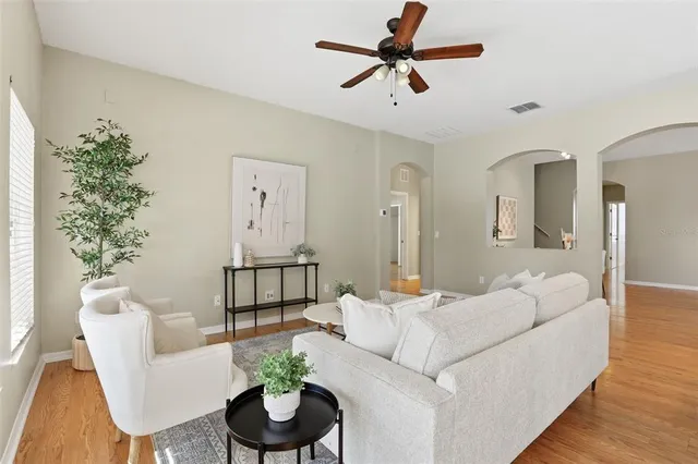 a bed room with a bed and a chandelier