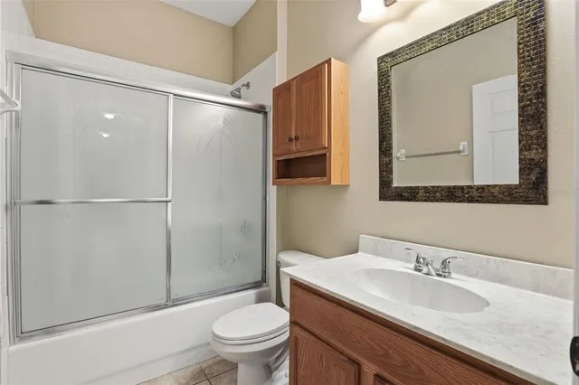a living room with furniture and white walls