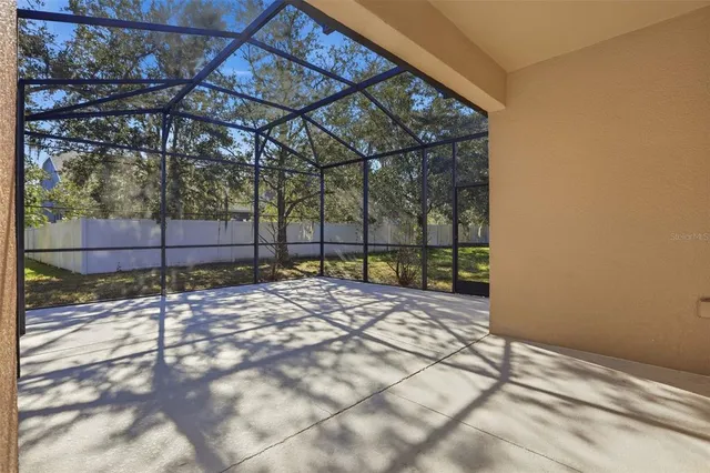 an aerial view of a house with a lake view