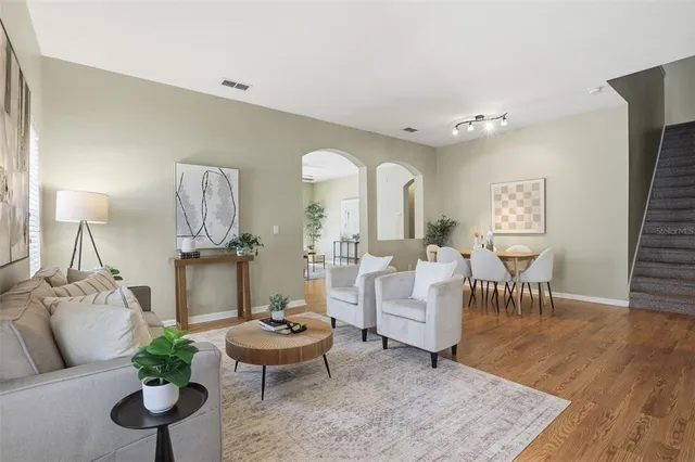 a living room with furniture and a large window