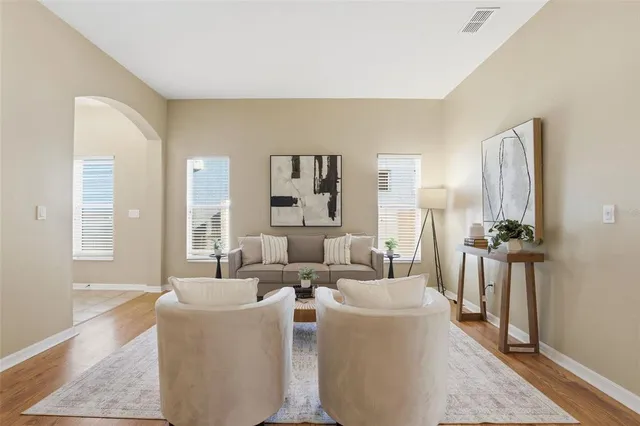 a living room with furniture and a table