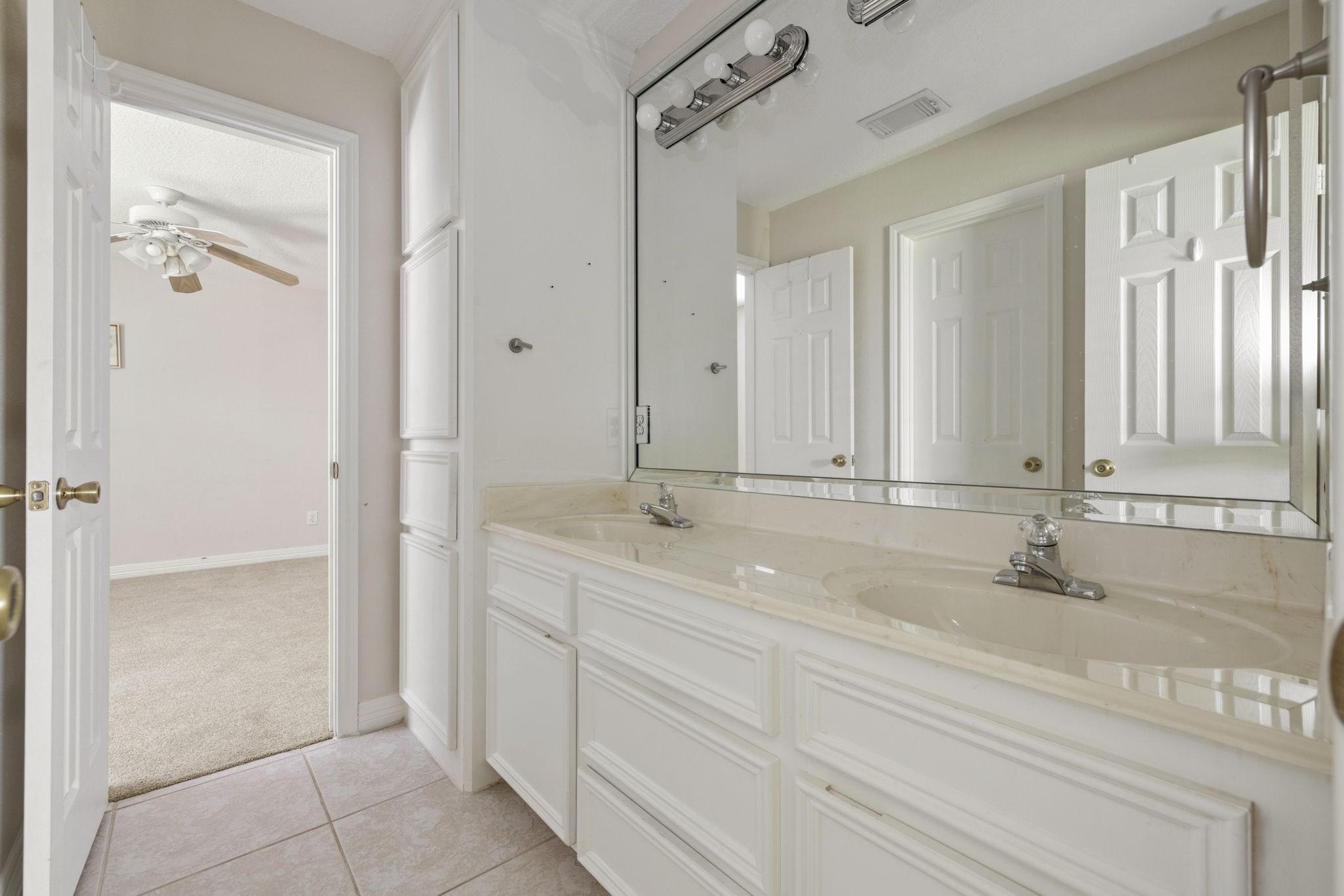 8022 Duffield Lane Houston, TX 77071 - Photo 13 of 19 a bathroom with a double vanity sink and a mirror