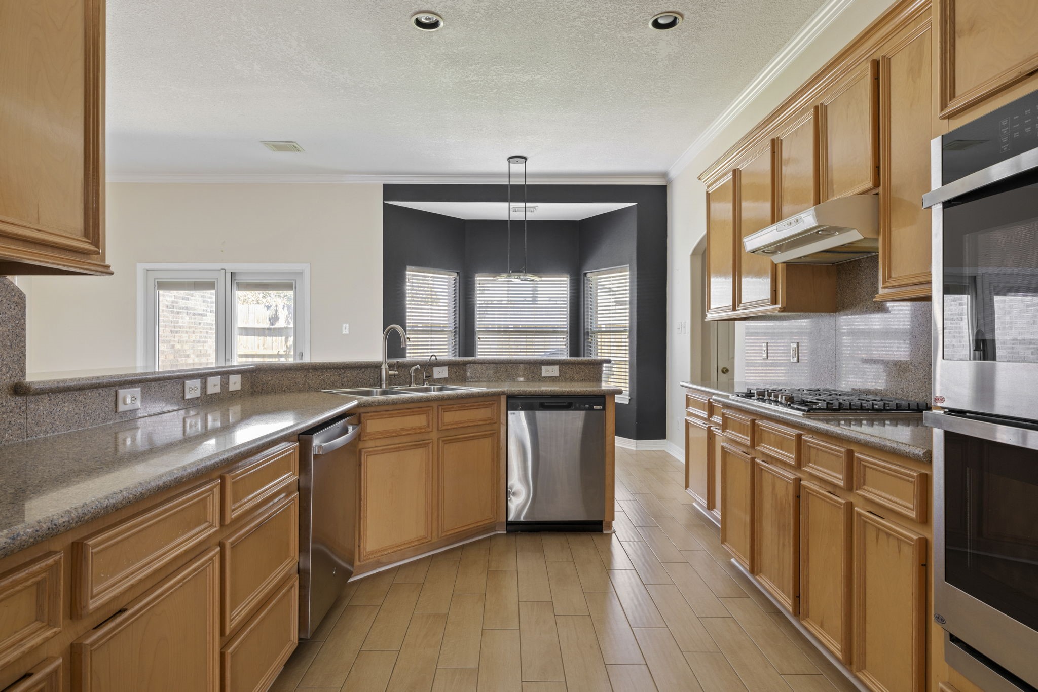 8022 Duffield Lane Houston, TX 77071 - Photo 2 of 19 a kitchen with granite countertop a sink stainless steel appliances and cabinets