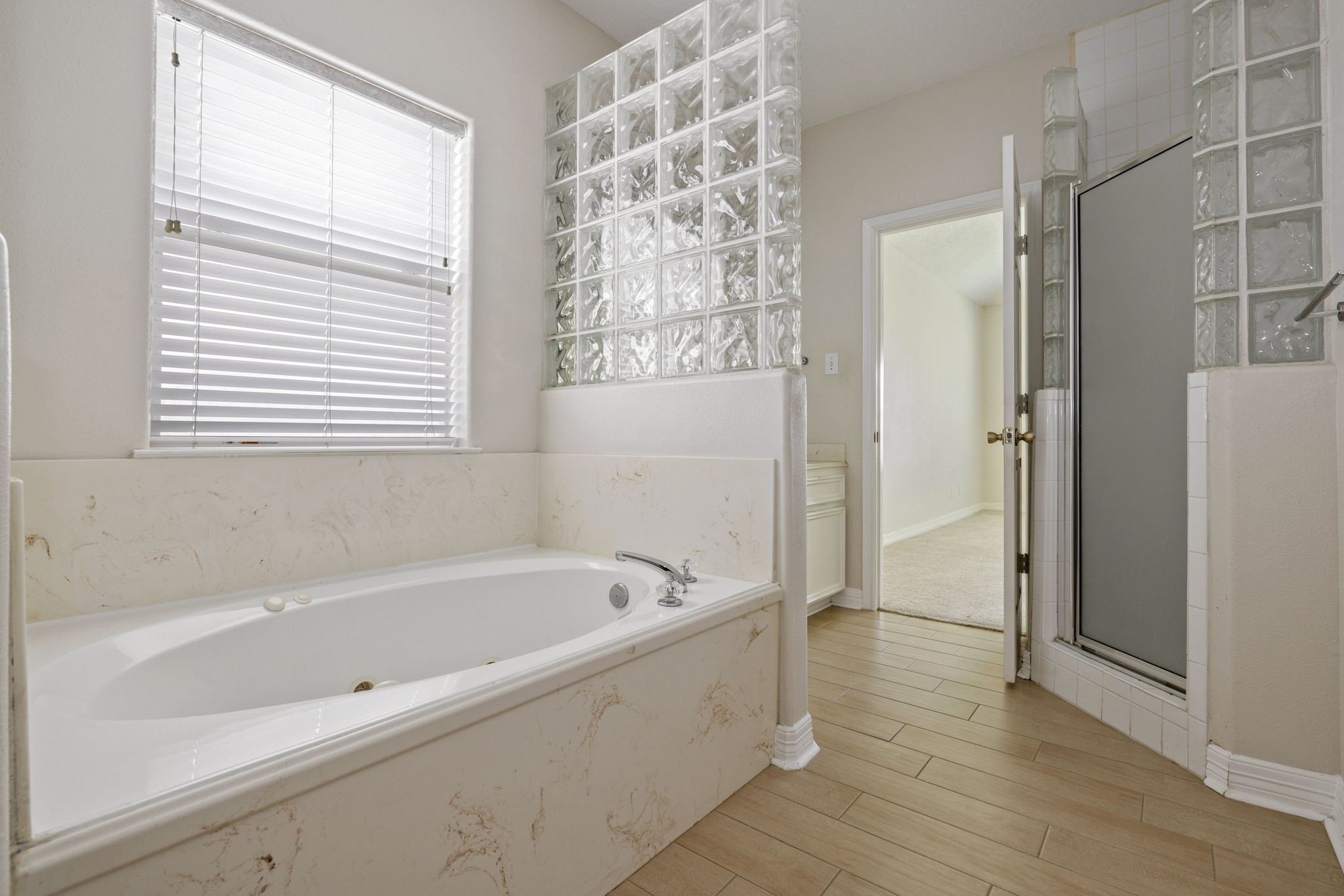 8022 Duffield Lane Houston, TX 77071 - Photo 5 of 19 a bathroom with a bathtub and a shower