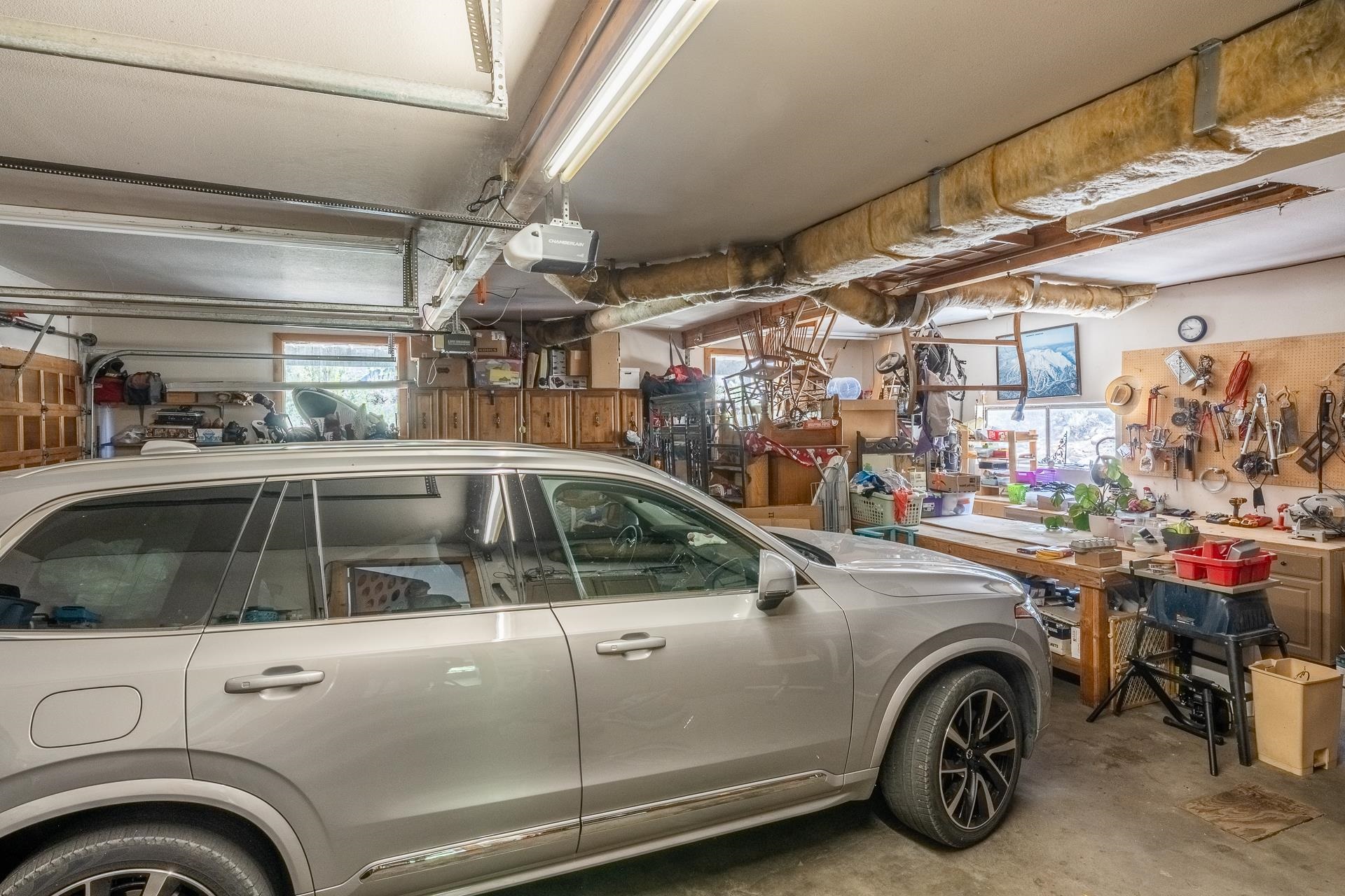 537 Aspen Spring Ranch Road Mammoth Lakes, CA 93546 - Photo 25 of 40 Attached garage space featuring overhead fluorescent lighting and exposed ductwork