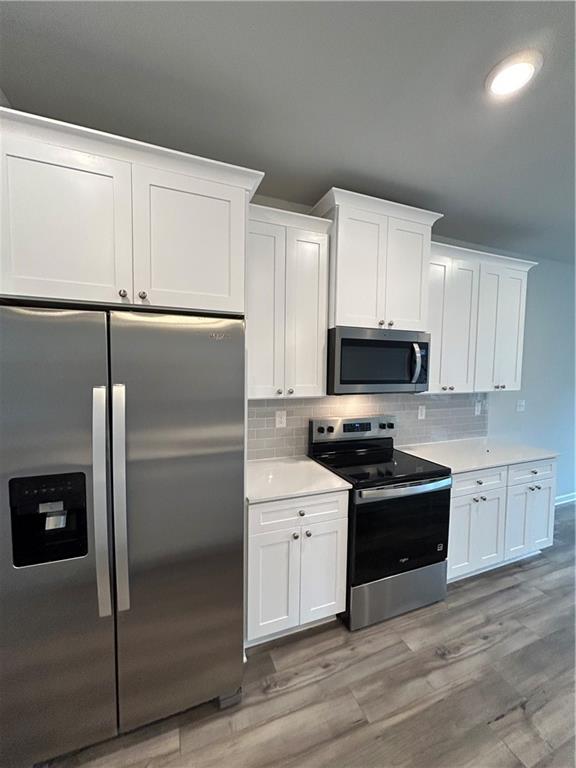 153 Werner Atlanta, GA 30310 - Photo 3 of 8 a kitchen with cabinets stainless steel appliances and a counter space