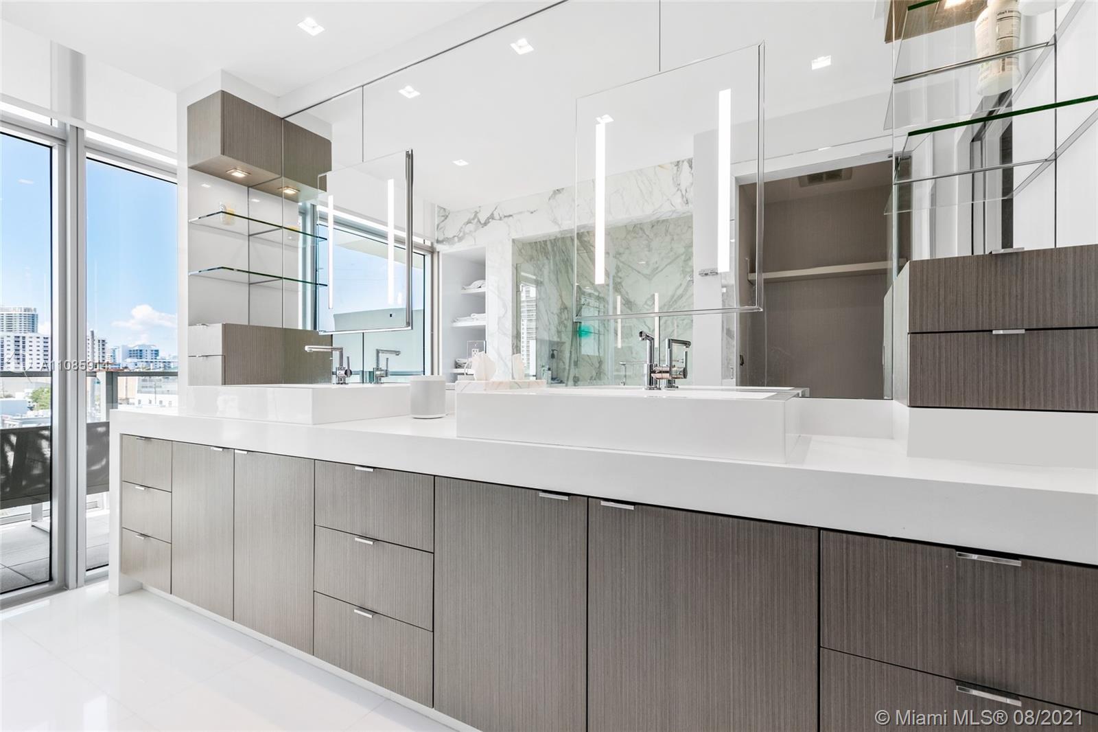 1201 20th Street, Unit PH08 Miami Beach, FL 33139 - Photo 17 of 28 a kitchen with stainless steel appliances a sink and a refrigerator