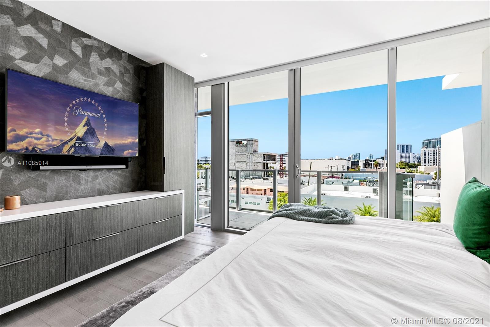 1201 20th Street, Unit PH08 Miami Beach, FL 33139 - Photo 19 of 28 a bedroom with a bed and a flat screen tv