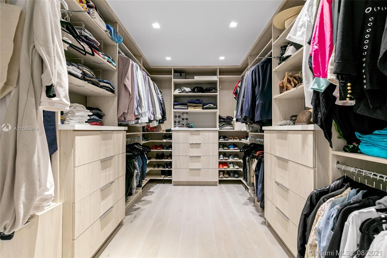 1201 20th Street, Unit PH08 Miami Beach, FL 33139 - Photo 20 of 28 a view of walk in closet with clothes and shoes