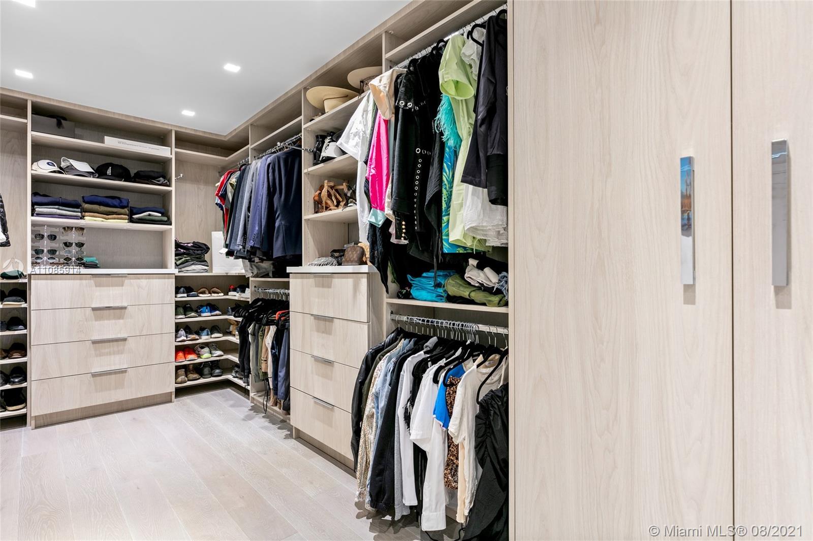 1201 20th Street, Unit PH08 Miami Beach, FL 33139 - Photo 21 of 28 a view of walk in closet with clothes and shoes