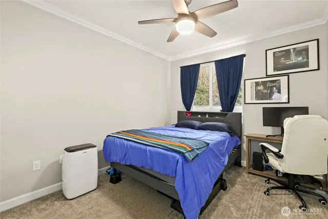a bedroom with a bed and a desk