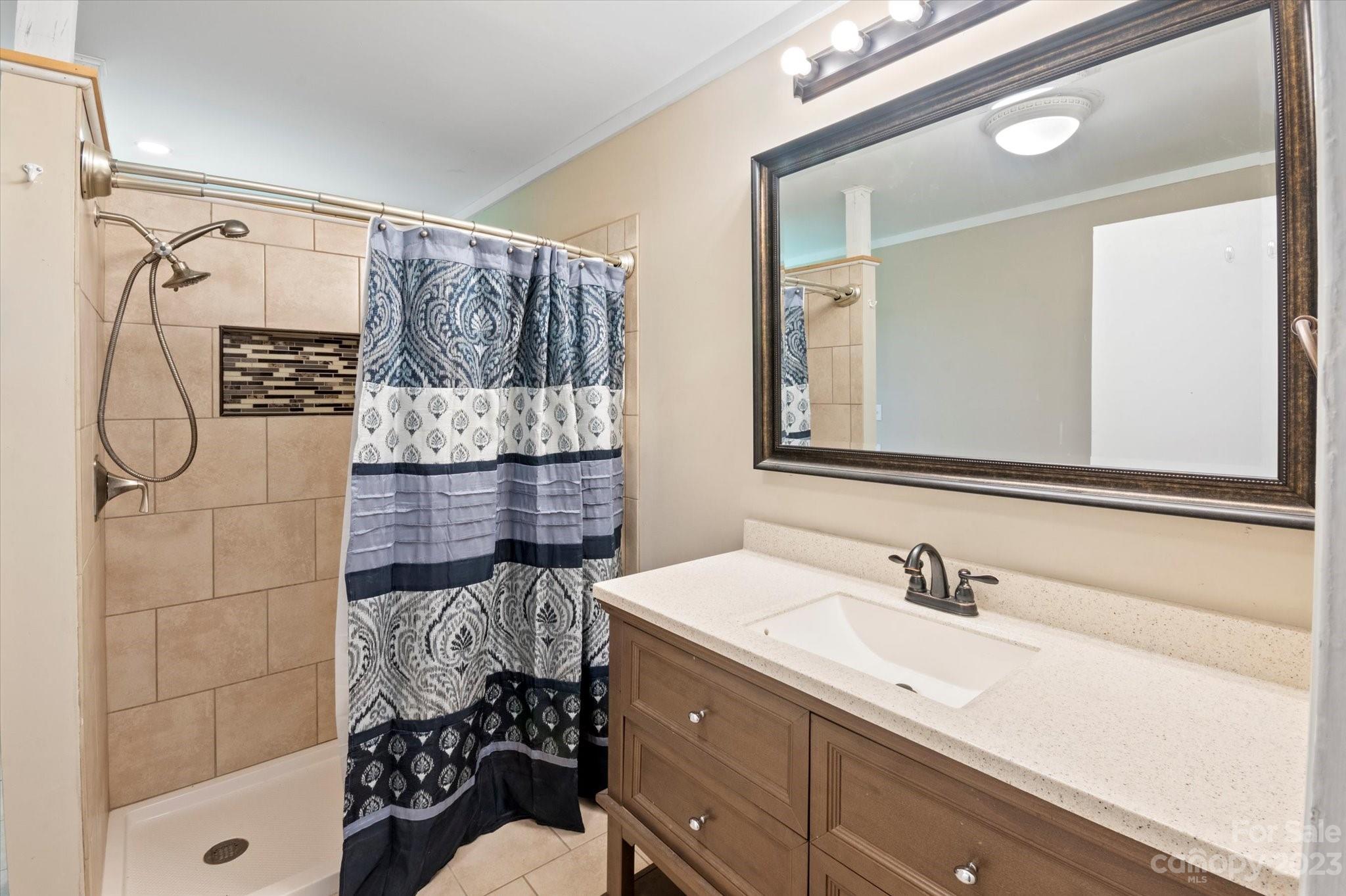 206 West View Street Rutherfordton, NC 28139 - Photo 11 of 39 a bathroom with a sink and a shower