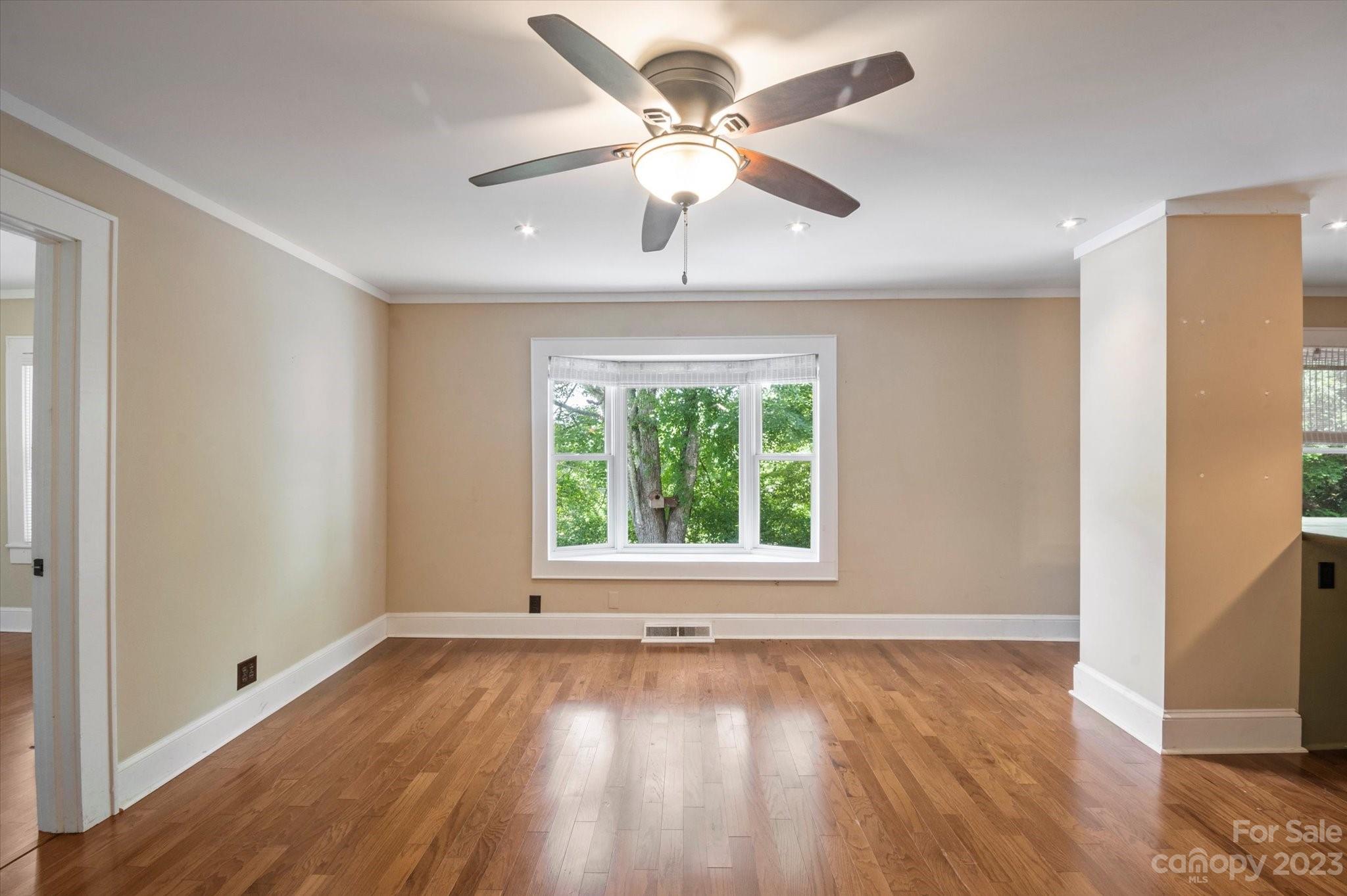 206 West View Street Rutherfordton, NC 28139 - Photo 23 of 39 a view of an empty room with wooden floor and a window