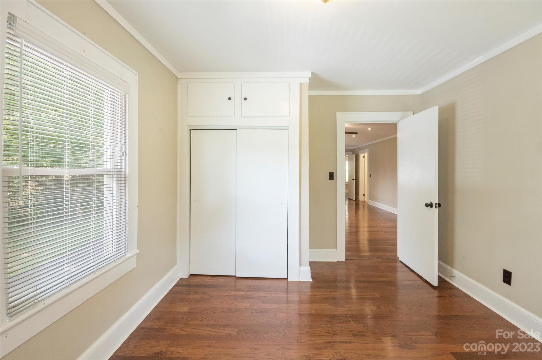 206 West View Street Rutherfordton, NC 28139 - Photo 27 of 39 a view of an empty room with wooden floor and a window