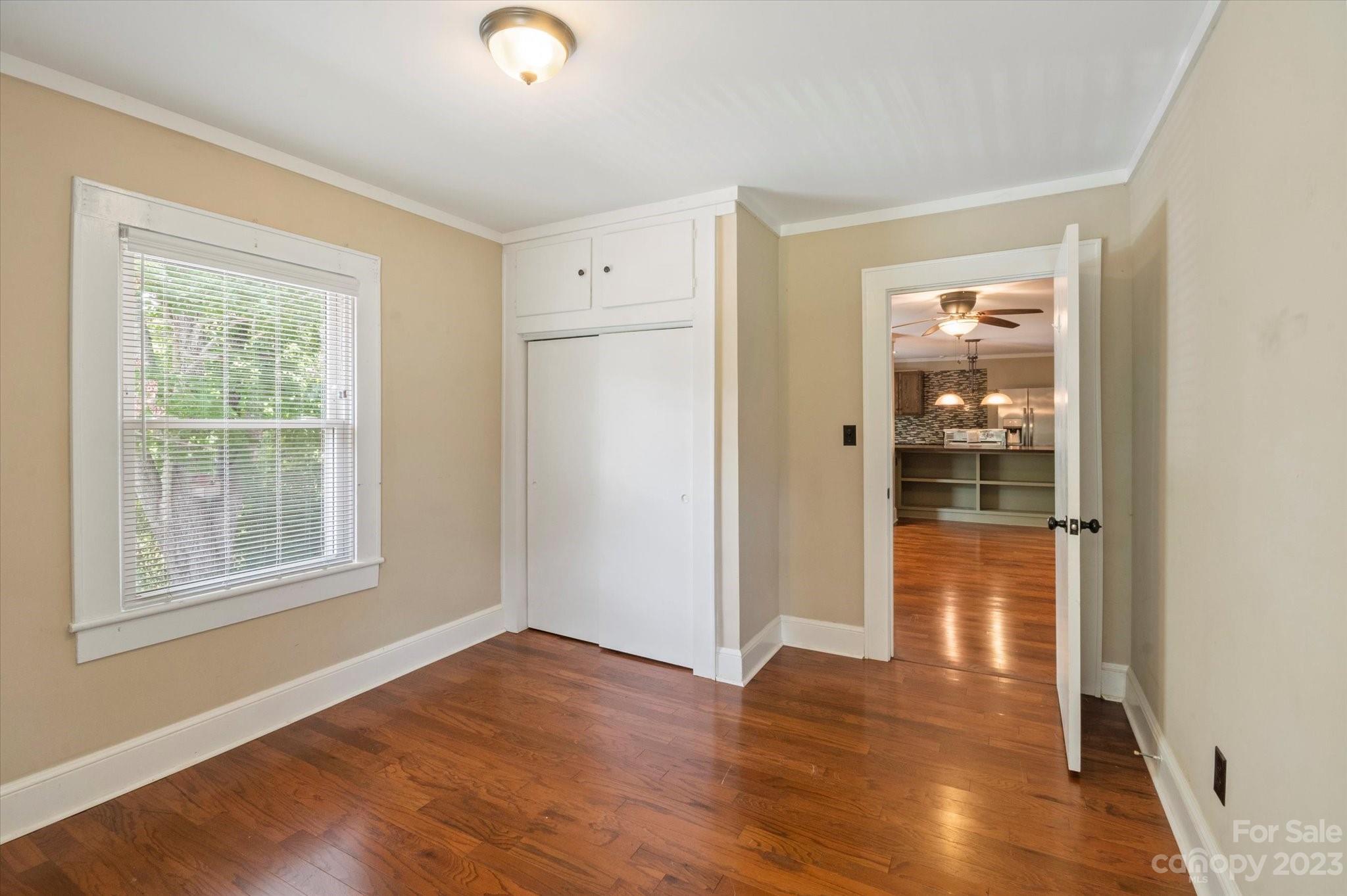 206 West View Street Rutherfordton, NC 28139 - Photo 28 of 39 an empty room with wooden floor and windows