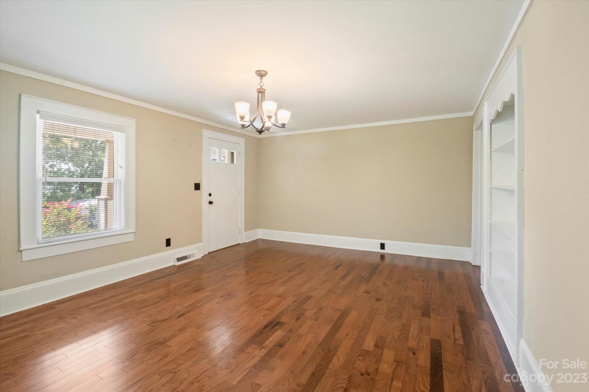 206 West View Street Rutherfordton, NC 28139 - Photo 30 of 39 a view of an empty room with wooden floor and a window