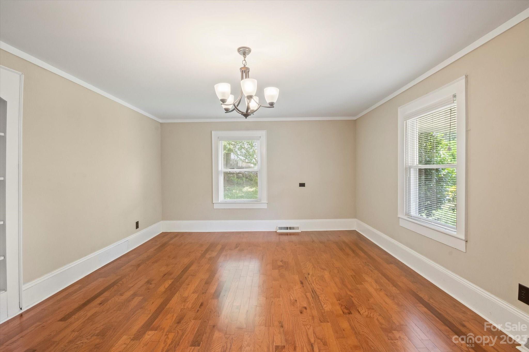 206 West View Street Rutherfordton, NC 28139 - Photo 32 of 39 wooden floor in an empty room with a window