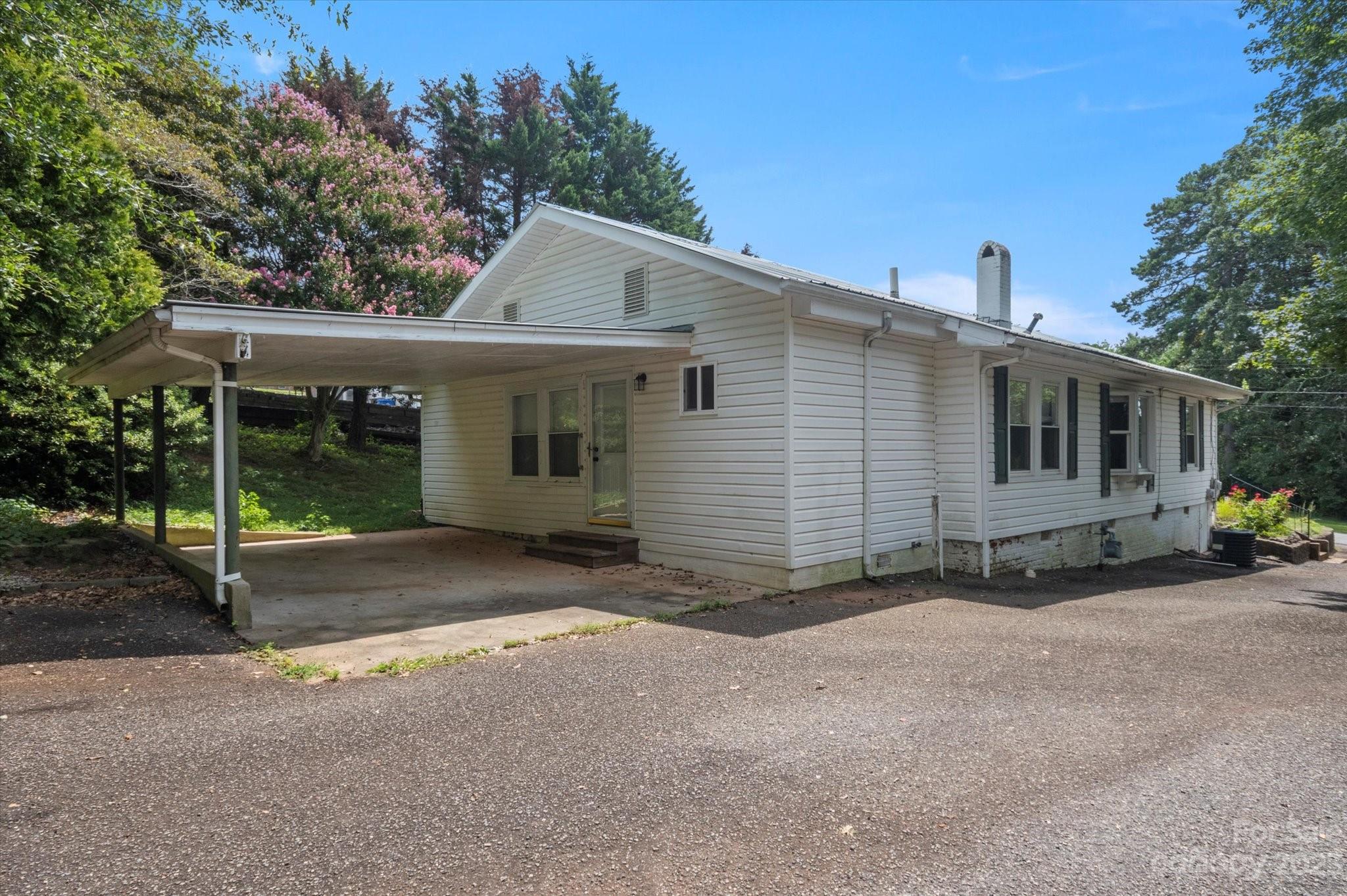 206 West View Street Rutherfordton, NC 28139 - Photo 36 of 39 a view of a house with backyard and bushes