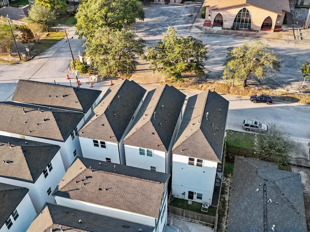 an aerial view of a house with a swimming pool