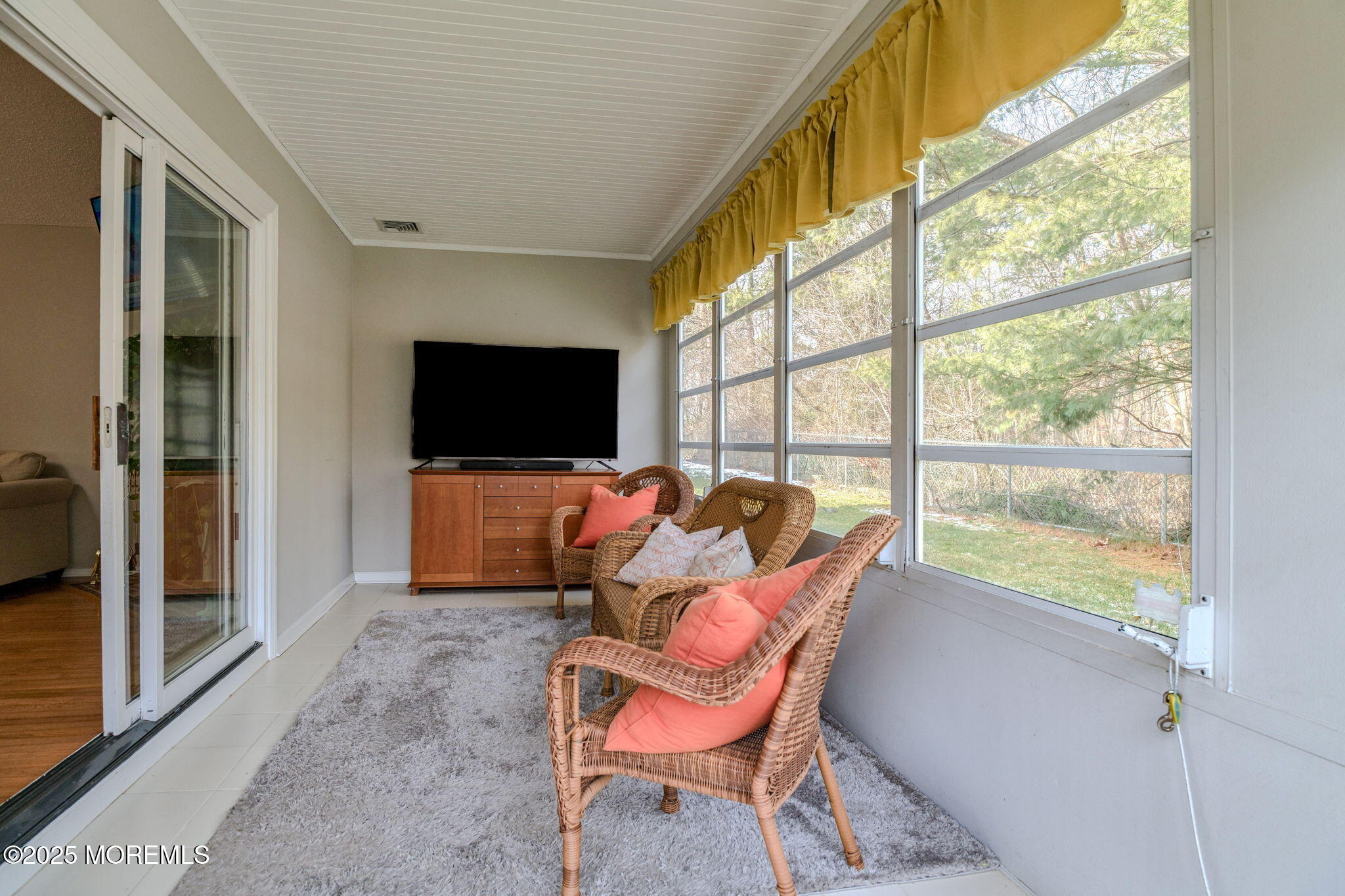 16 Deer Run Lane Brick, NJ 08724 - Photo 16 of 41 a living room with a large window and a flat screen tv