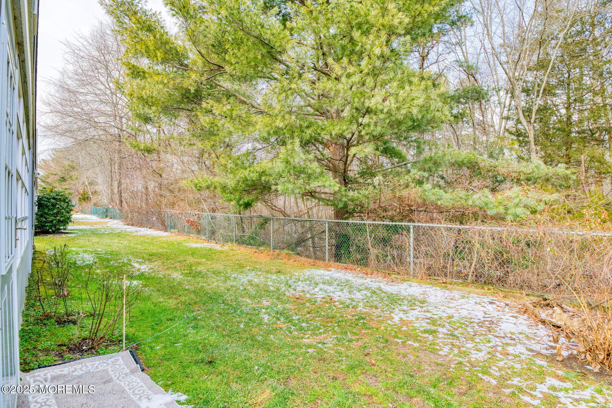16 Deer Run Lane Brick, NJ 08724 - Photo 17 of 41 a backyard of a house with lots of green space and lake view