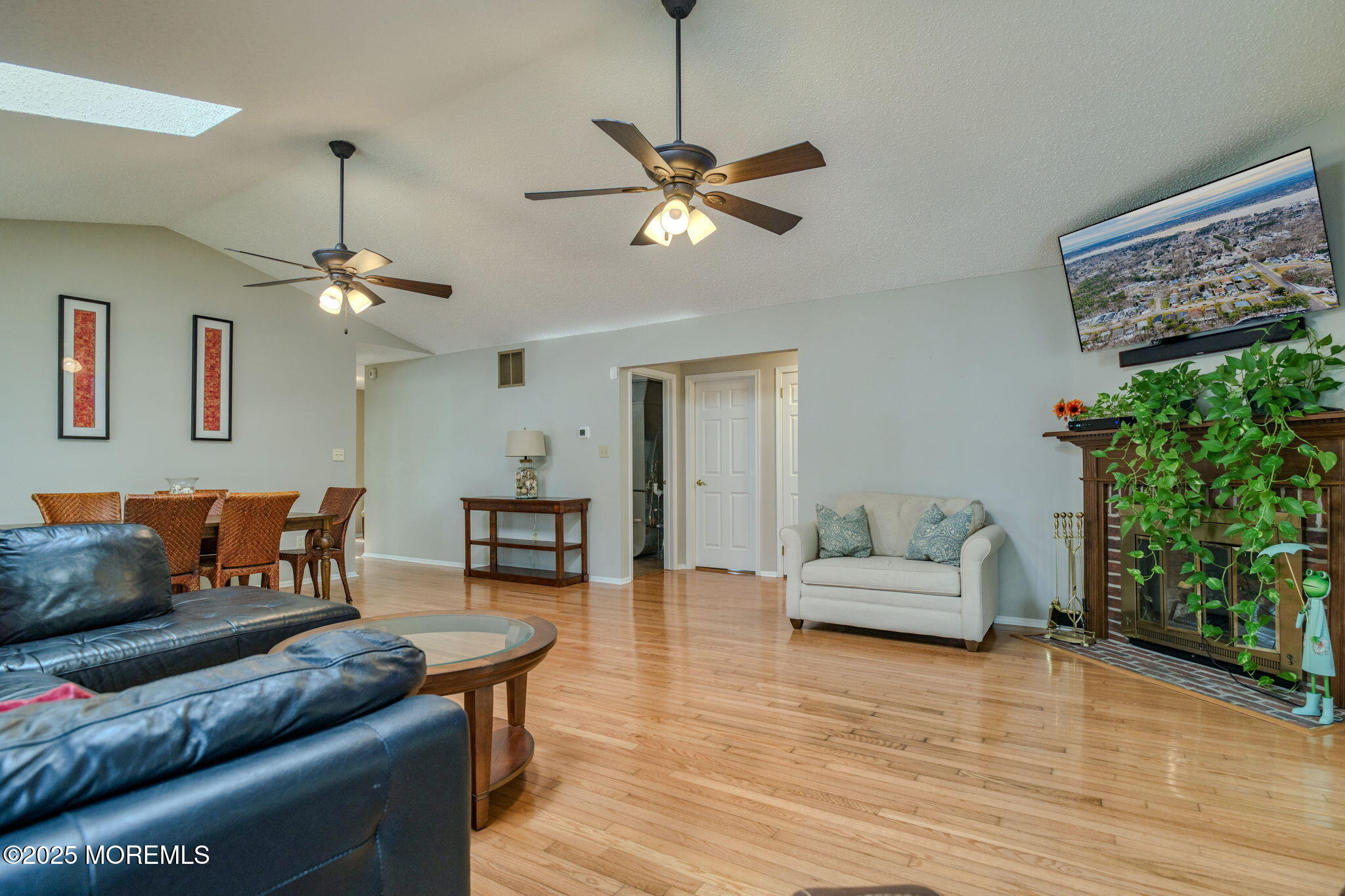 16 Deer Run Lane Brick, NJ 08724 - Photo 22 of 41 a living room with furniture and a chandelier