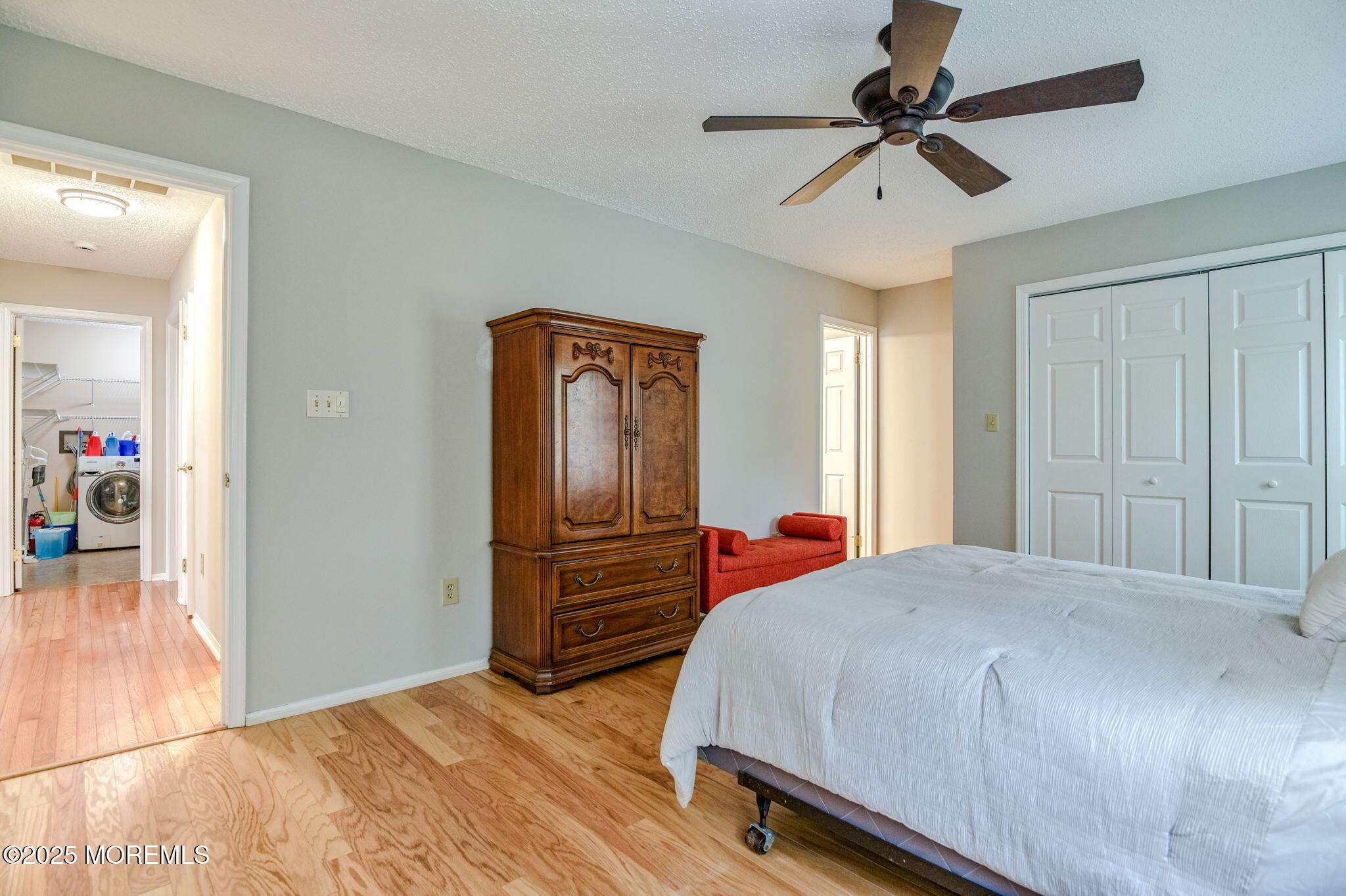 16 Deer Run Lane Brick, NJ 08724 - Photo 23 of 41 a bedroom with a bed and a chandelier