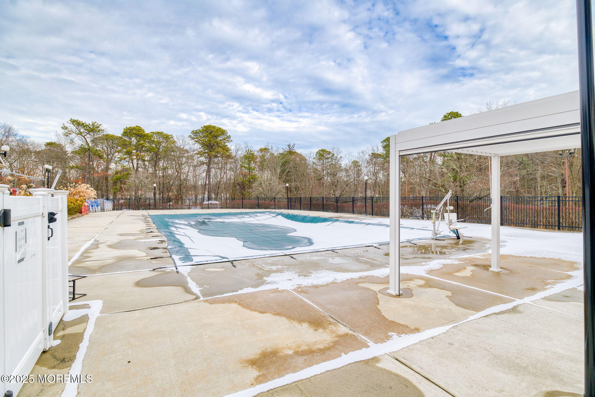 16 Deer Run Lane Brick, NJ 08724 - Photo 37 of 41 a view of a swimming pool with a lawn chairs