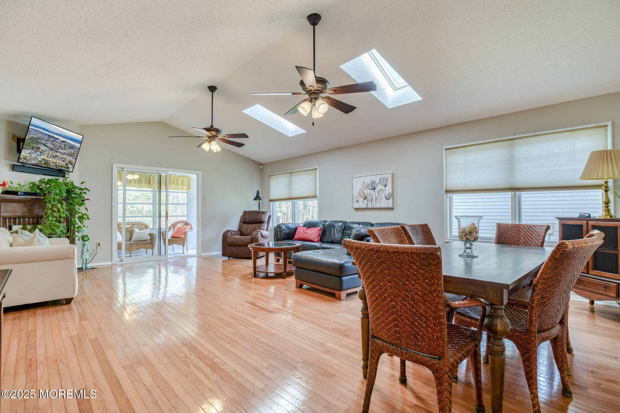 16 Deer Run Lane Brick, NJ 08724 - Photo 10 of 41 a living room with furniture a chandelier and a wooden floor