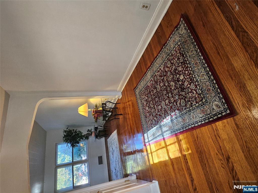 55 Rutgers Place River Edge, NJ 07661 - Photo 5 of 23 a room with wooden floor and a table