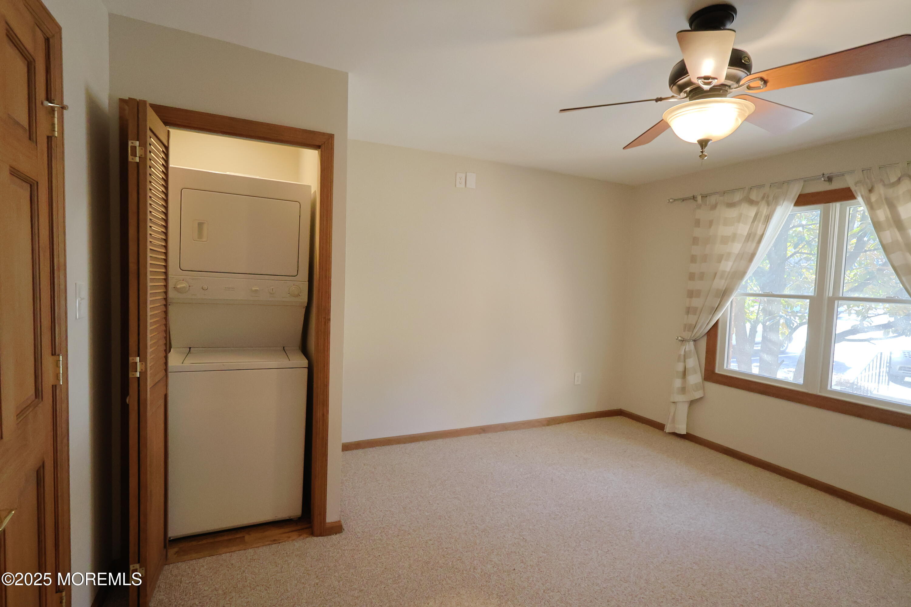 200 Portland Road, Unit A5 Highlands, NJ 07732 - Photo 14 of 30 an empty room with a window and ceiling fan