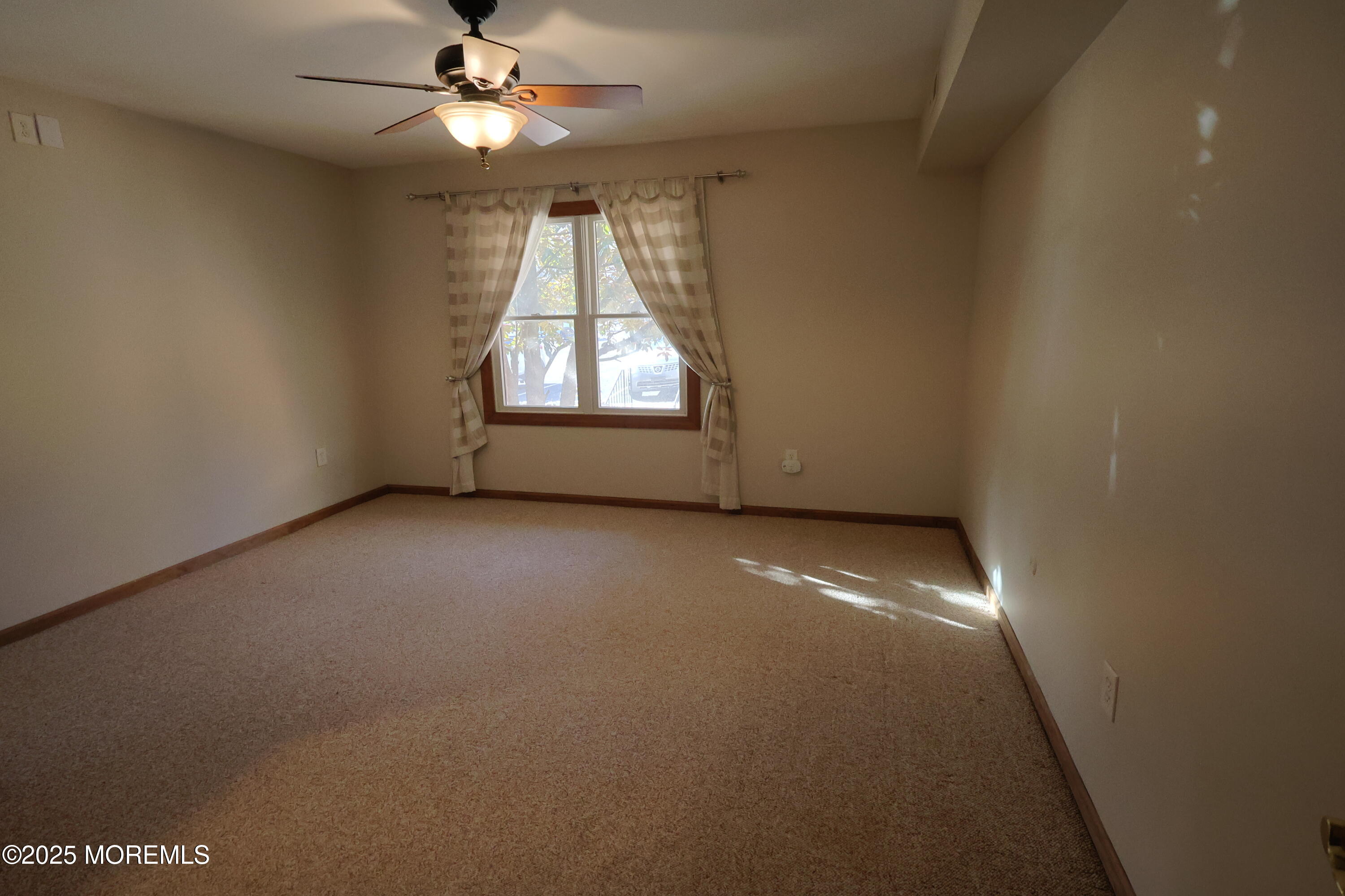 200 Portland Road, Unit A5 Highlands, NJ 07732 - Photo 15 of 30 an empty room with a window and a fan