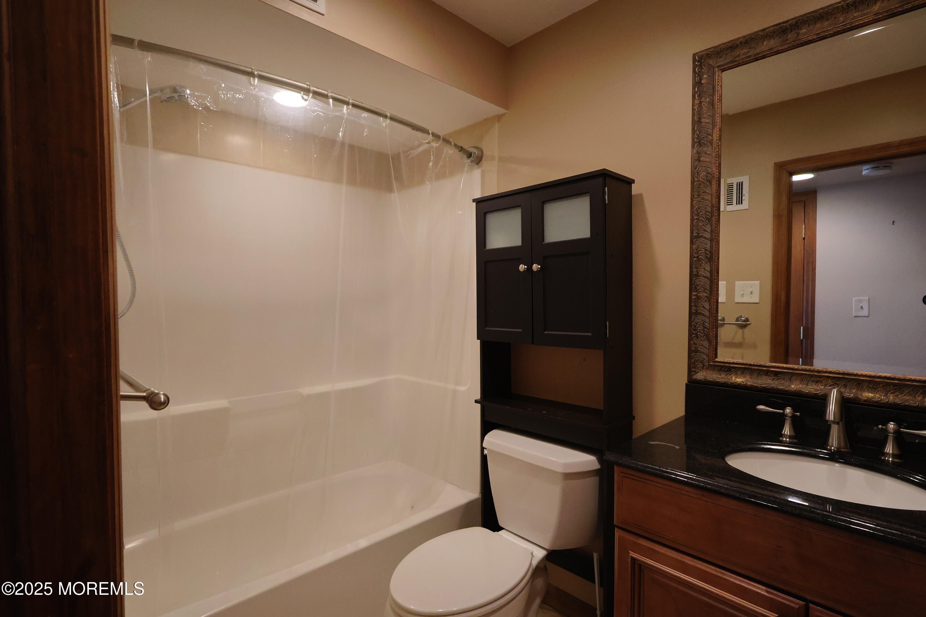 200 Portland Road, Unit A5 Highlands, NJ 07732 - Photo 17 of 30 a bathroom with a granite countertop bathtub shower sink vanity and toilet