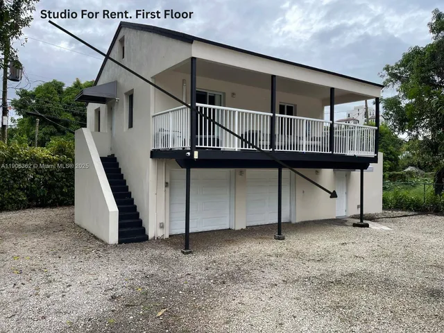 a house view with a backyard space