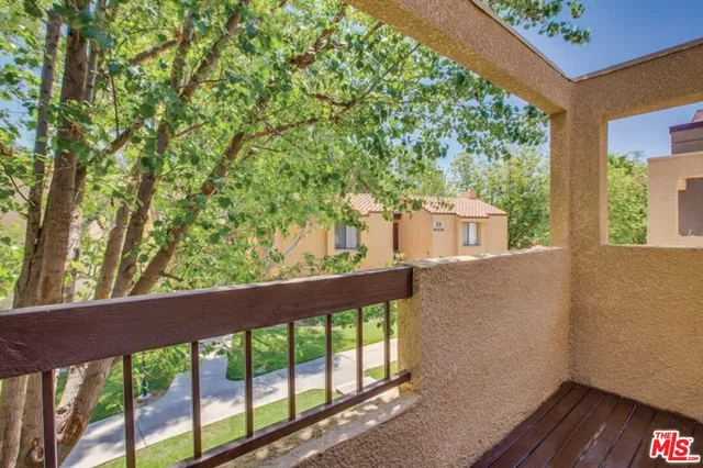 a view of a balcony with an outdoor space