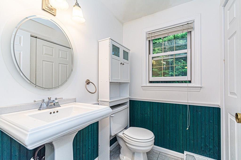 487 Boston Road Groton, MA 01450 - Photo 5 of 32 a bathroom with a sink a toilet and a mirror
