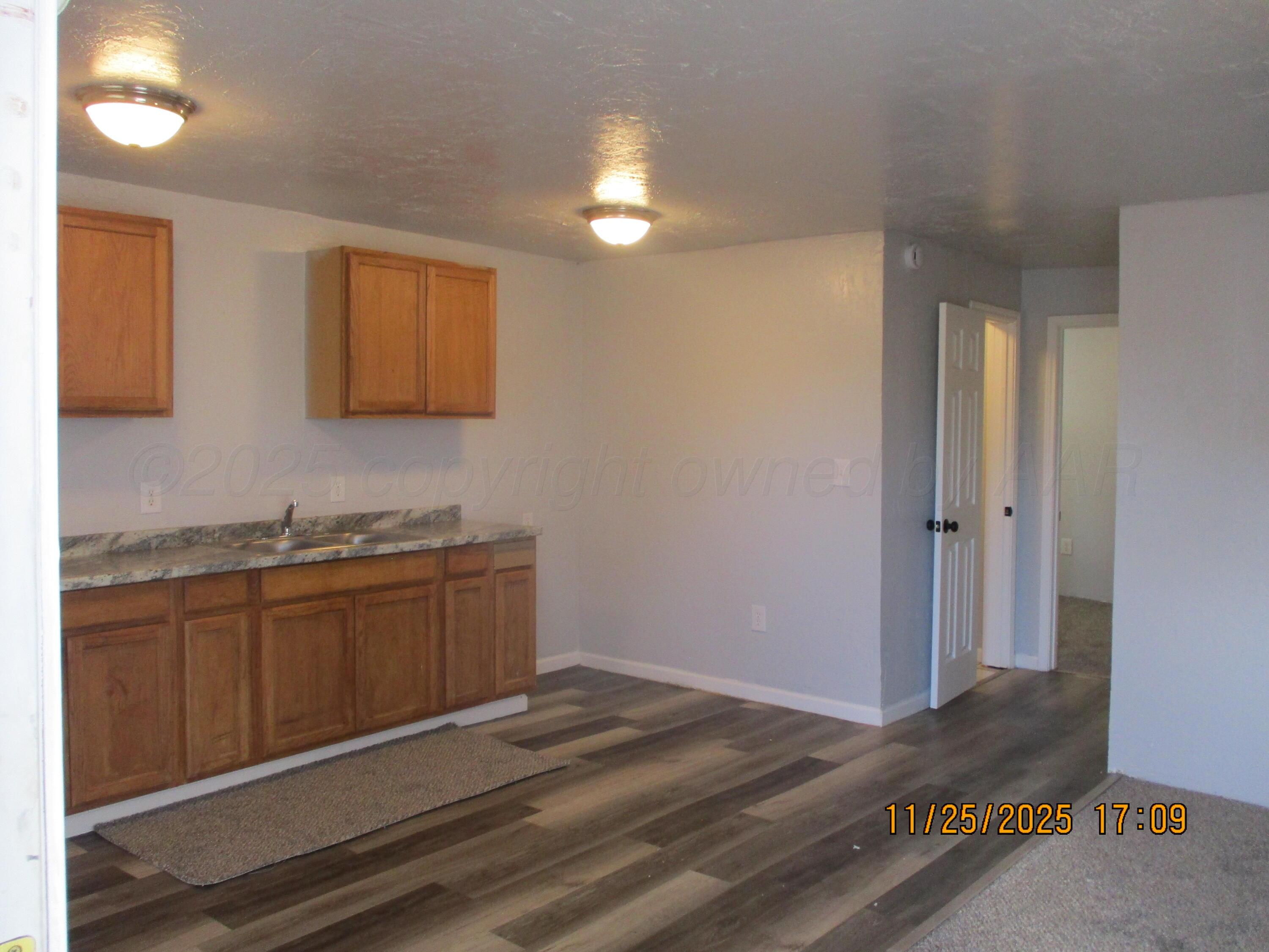 3811 Southeast 14th Avenue Amarillo, TX 79104 - Photo 3 of 6 a bathroom with a sink and a mirror