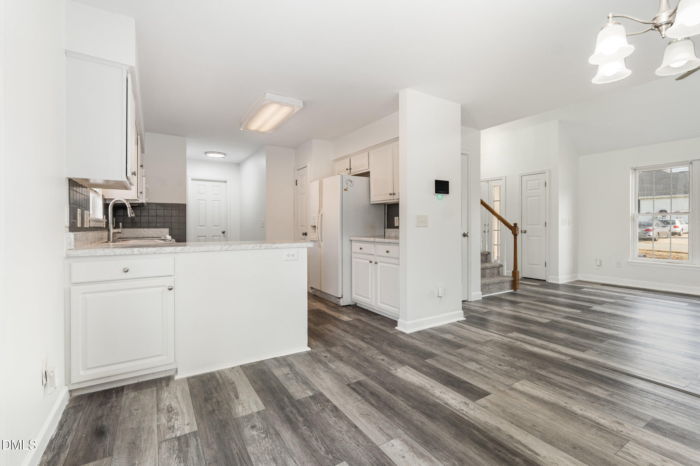 700 Thompson Road Graham, NC 27253 - Photo 10 of 34 a kitchen with white cabinets and sink