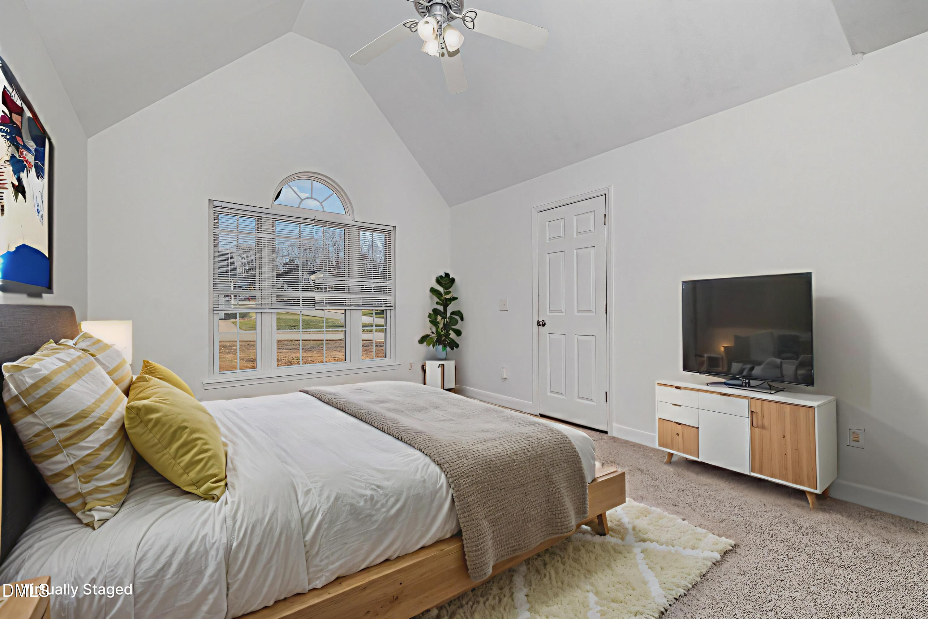700 Thompson Road Graham, NC 27253 - Photo 19 of 34 a bedroom with a bed and a flat screen tv